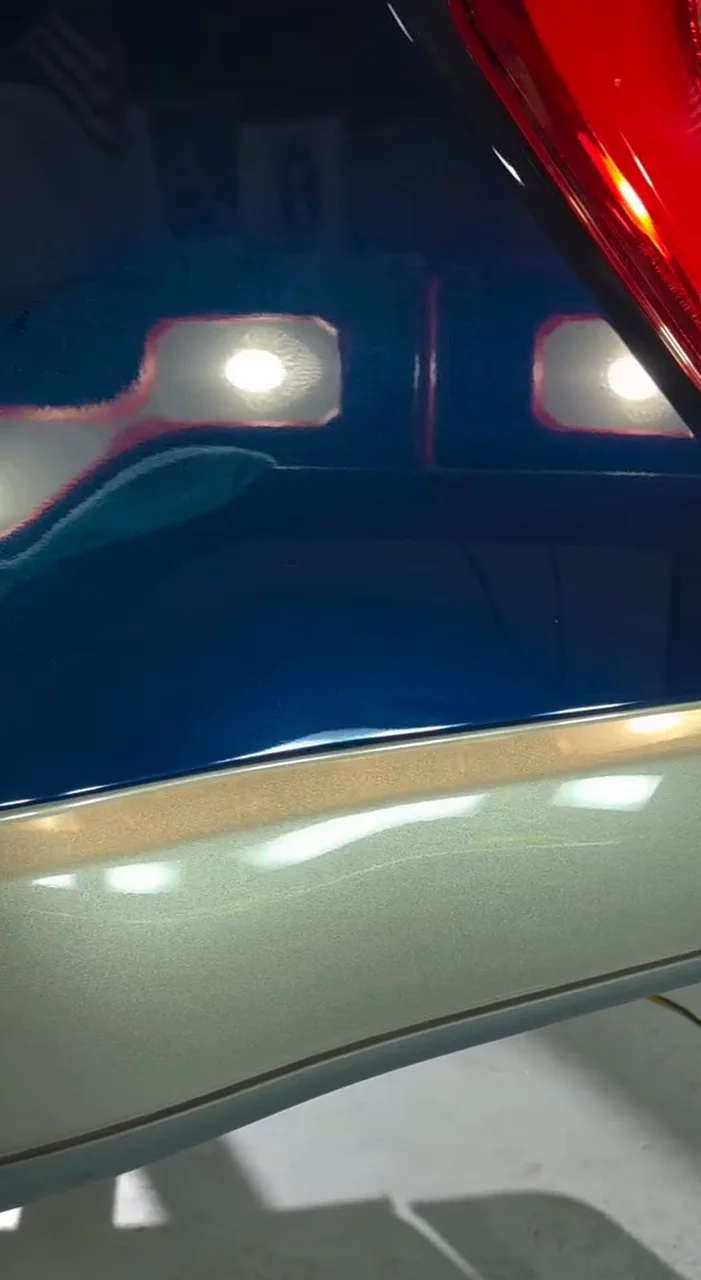 After: Same truck, same panel, same shop lights: swirled paint before, corrected after