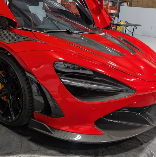 Front of a red McLaren 720S in the shop