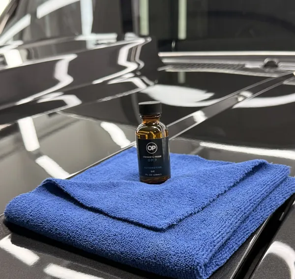 Coating bottle on a blue microfiber towel