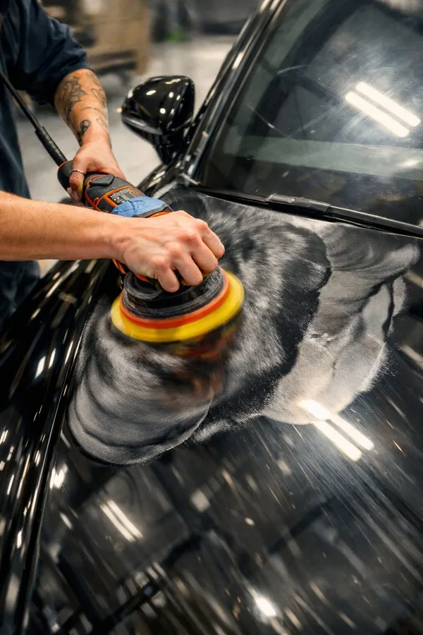 Rotary polisher working black paint