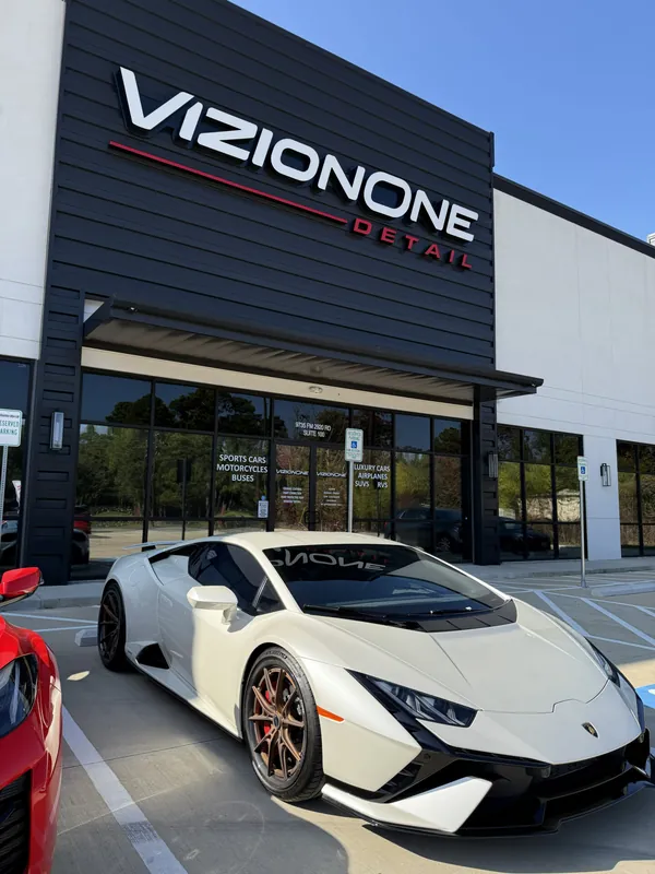 White Lamborghini Huracán at the storefront