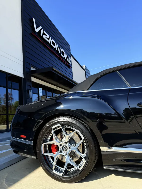 Black Bentley Continental GT at the storefront