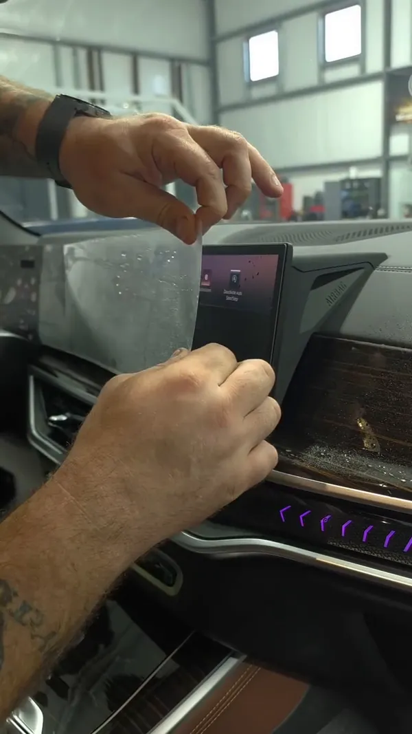 Screen protection film going on a dashboard screen