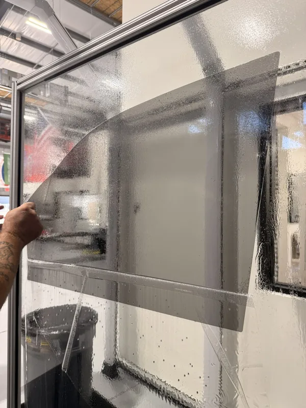 Tint film being applied to a window